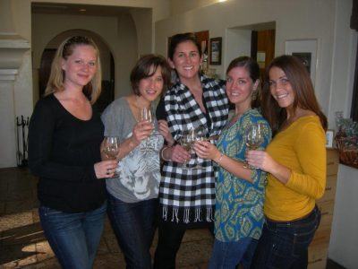 Wine tasting group holding their glasses