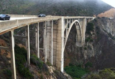 An Image Of A Bridge Spanning Over A Large Valley